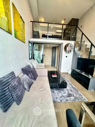 Modern duplex living room with stylish decor and mezzanine bedroom