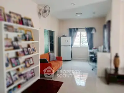 Charming living room with bright orange sofa and modern decor