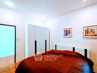 Modern bedroom with stylish decor and ample storage space