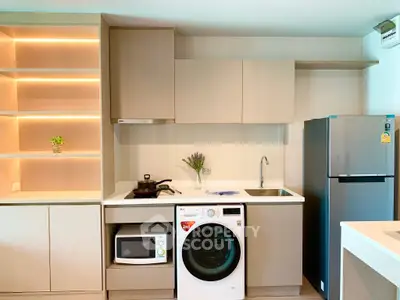 Modern kitchen with sleek appliances and stylish cabinetry