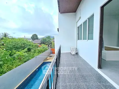 Spacious balcony with pool view in modern residential property