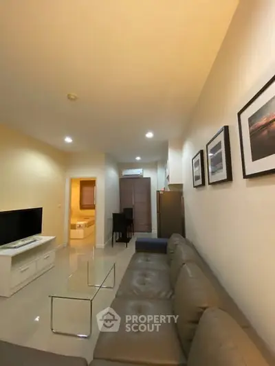 Spacious living room with modern decor and comfortable seating