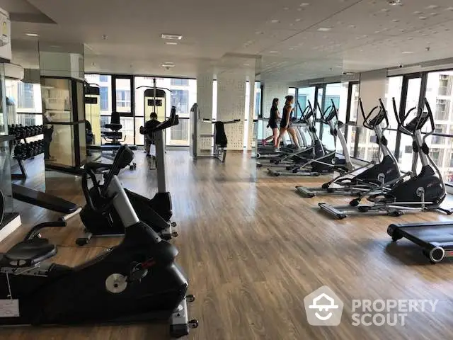 Spacious modern gym with state-of-the-art equipment and city views