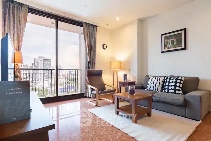 Spacious living room with city view, modern furniture, and large windows for natural light.