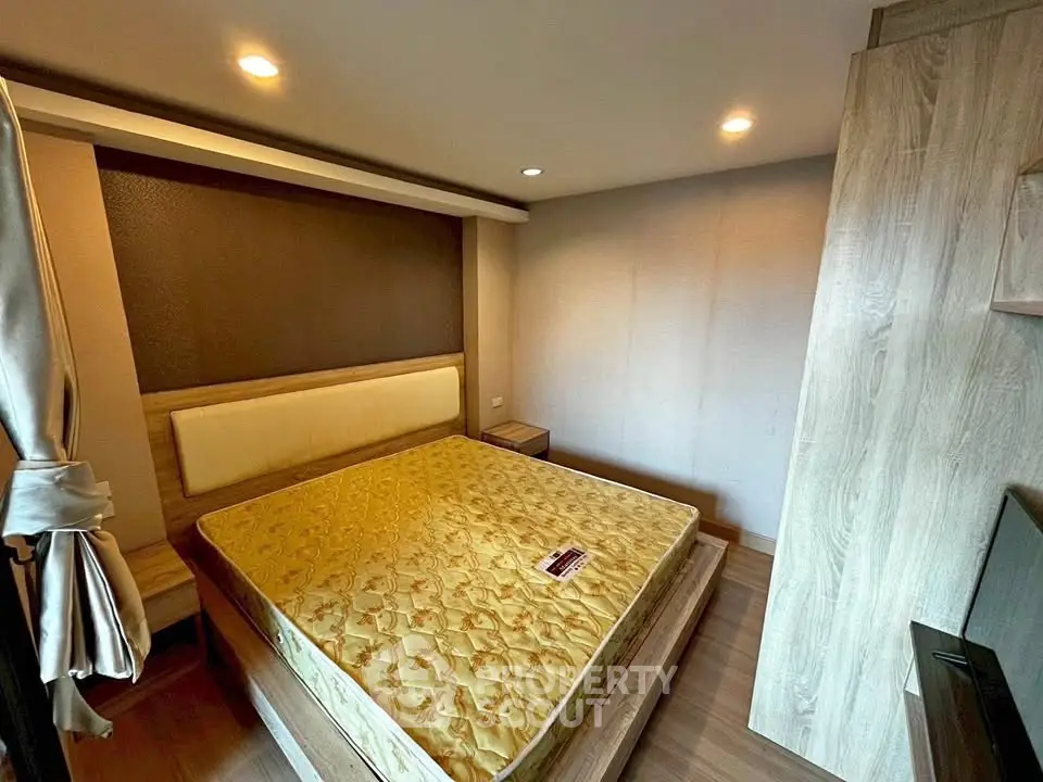 Modern bedroom with wooden furniture and cozy lighting