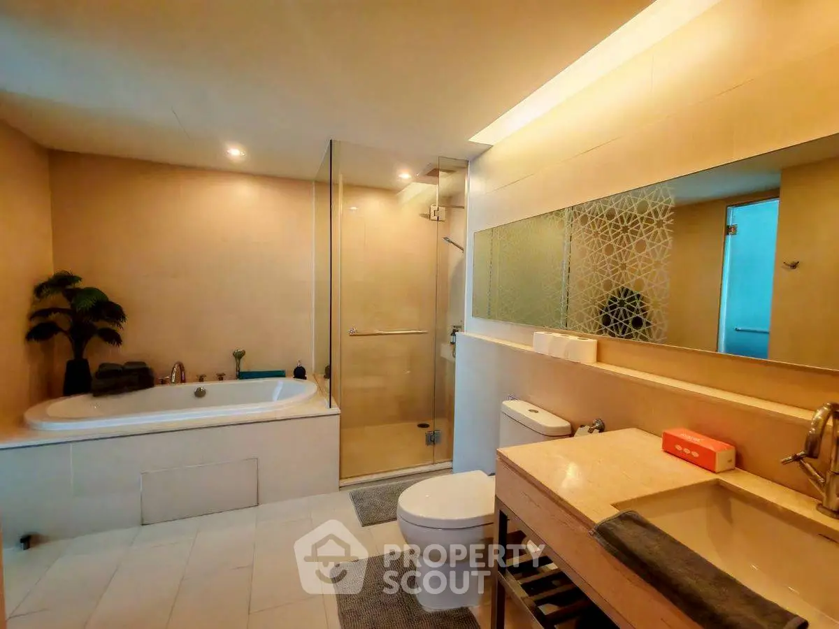 Luxurious bathroom with modern fixtures and spacious shower area
