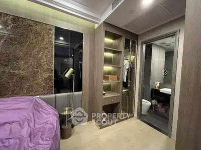 Modern bedroom with built-in closet and bathroom access