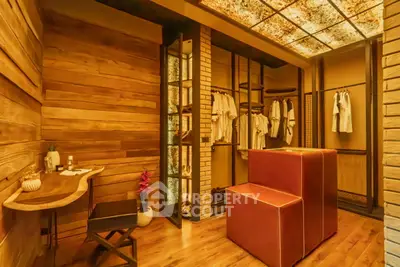 Luxurious walk-in closet with stylish wooden accents and modern lighting