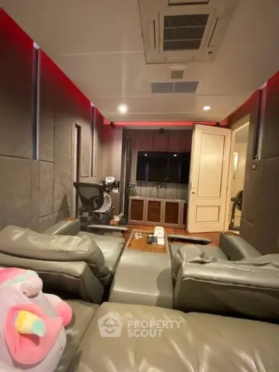 Luxurious home theater room with plush seating and ambient lighting