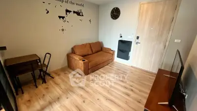 Modern living room with stylish decor and wooden flooring in a cozy apartment.