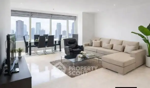 Spacious modern living room with city view, elegant furniture, and natural light.