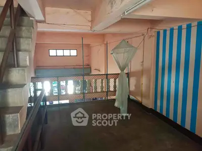 Spacious interior with unique design elements and ample natural light, perfect for creative transformations.