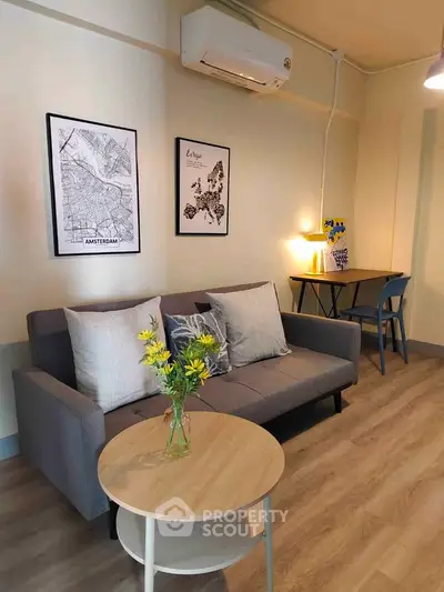 Stylish living room with modern decor and cozy seating area, perfect for relaxation.