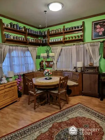 Charming vintage dining room with wooden furniture and decorative shelves.