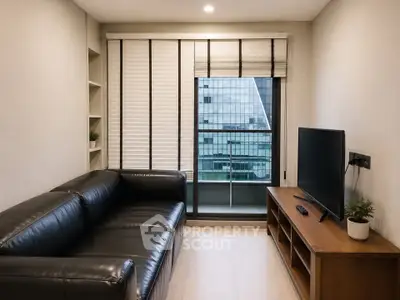 Modern living room with sleek black leather sofa and large TV, featuring a city view through large windows.
