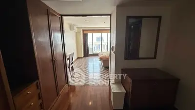 Spacious apartment with wooden flooring and balcony view