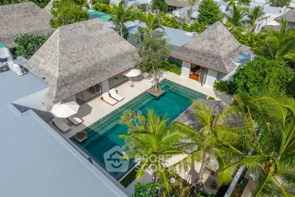 Luxurious tropical villa with private pool and lush greenery, perfect for serene living.
