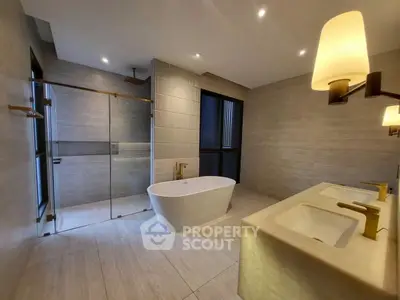 Luxurious modern bathroom with freestanding tub and dual sinks