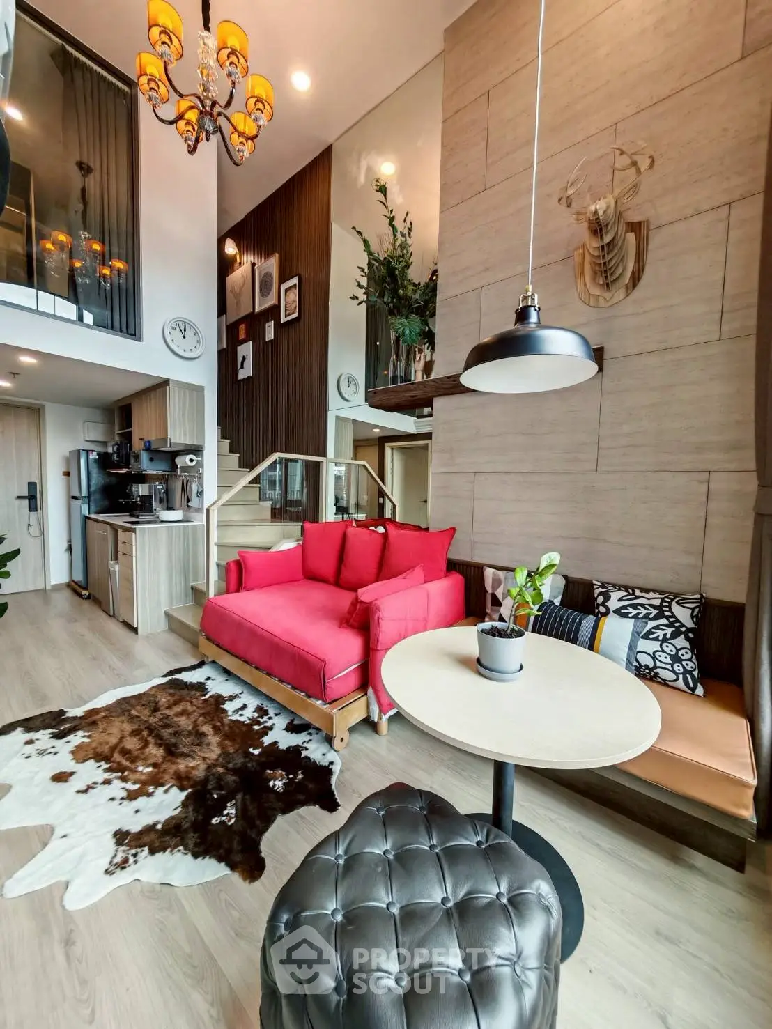 Modern duplex living room with red sofa and stylish decor