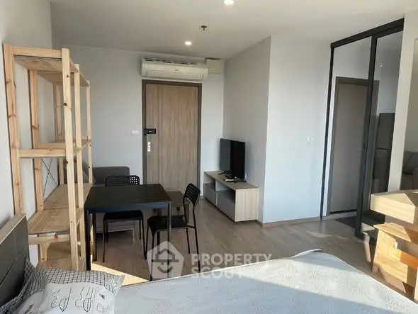 Modern studio apartment with sleek furniture and natural light