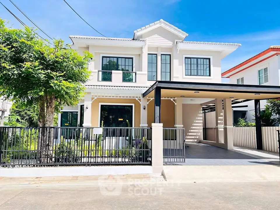 Stunning two-story modern house with spacious driveway and lush greenery, perfect for family living.