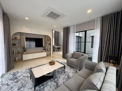 Luxurious modern living room with elegant decor and large windows