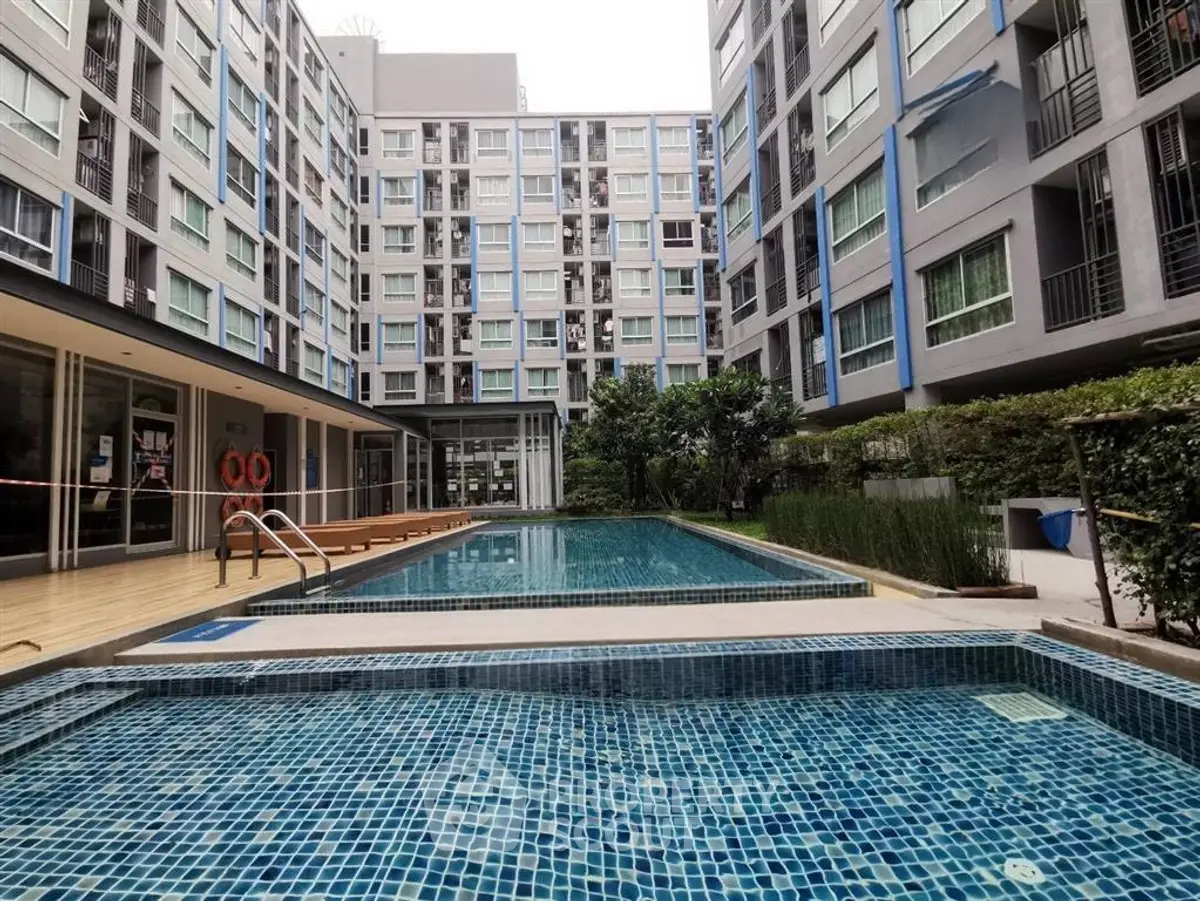 Modern condominium with outdoor swimming pool and stylish architecture