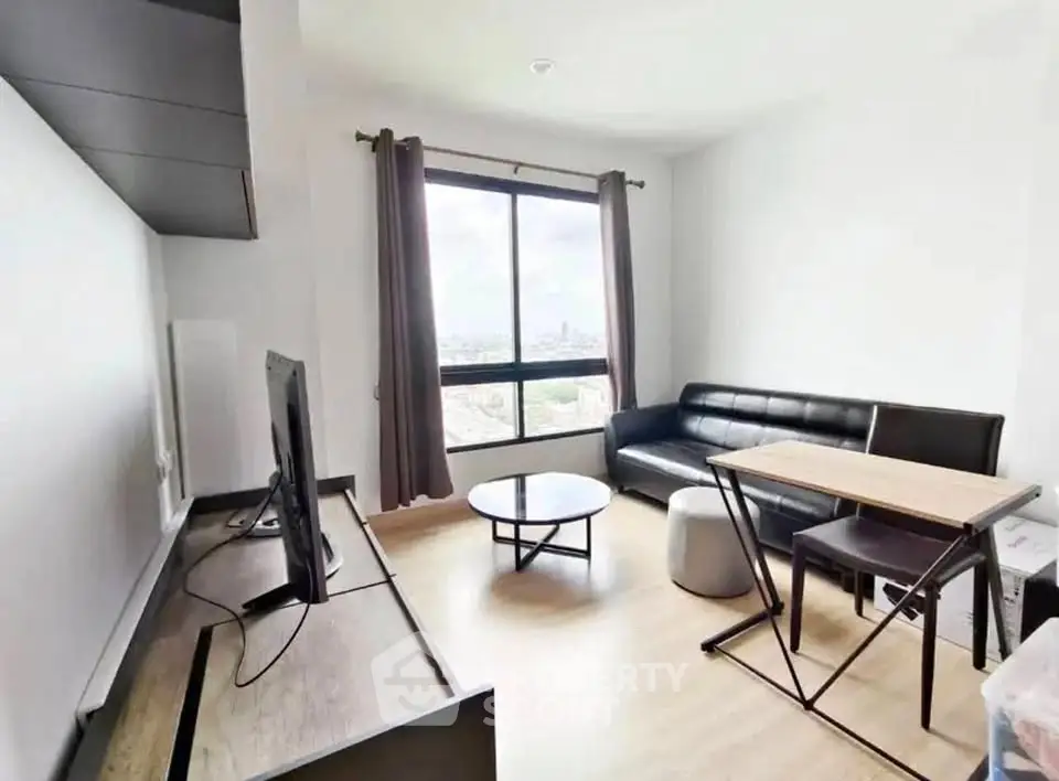 Modern living room with sleek furniture and large window view