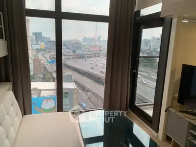 Modern living room with panoramic city view and stylish furniture