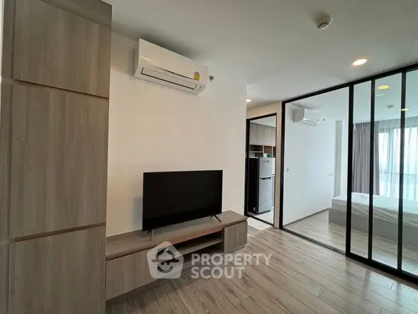 Modern apartment interior with sleek design and glass partition