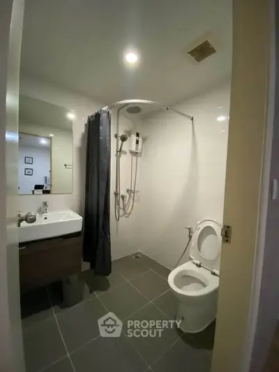 Modern bathroom with sleek fixtures and contemporary design.