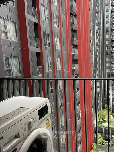 Modern urban apartment balcony with washing machine and city view
