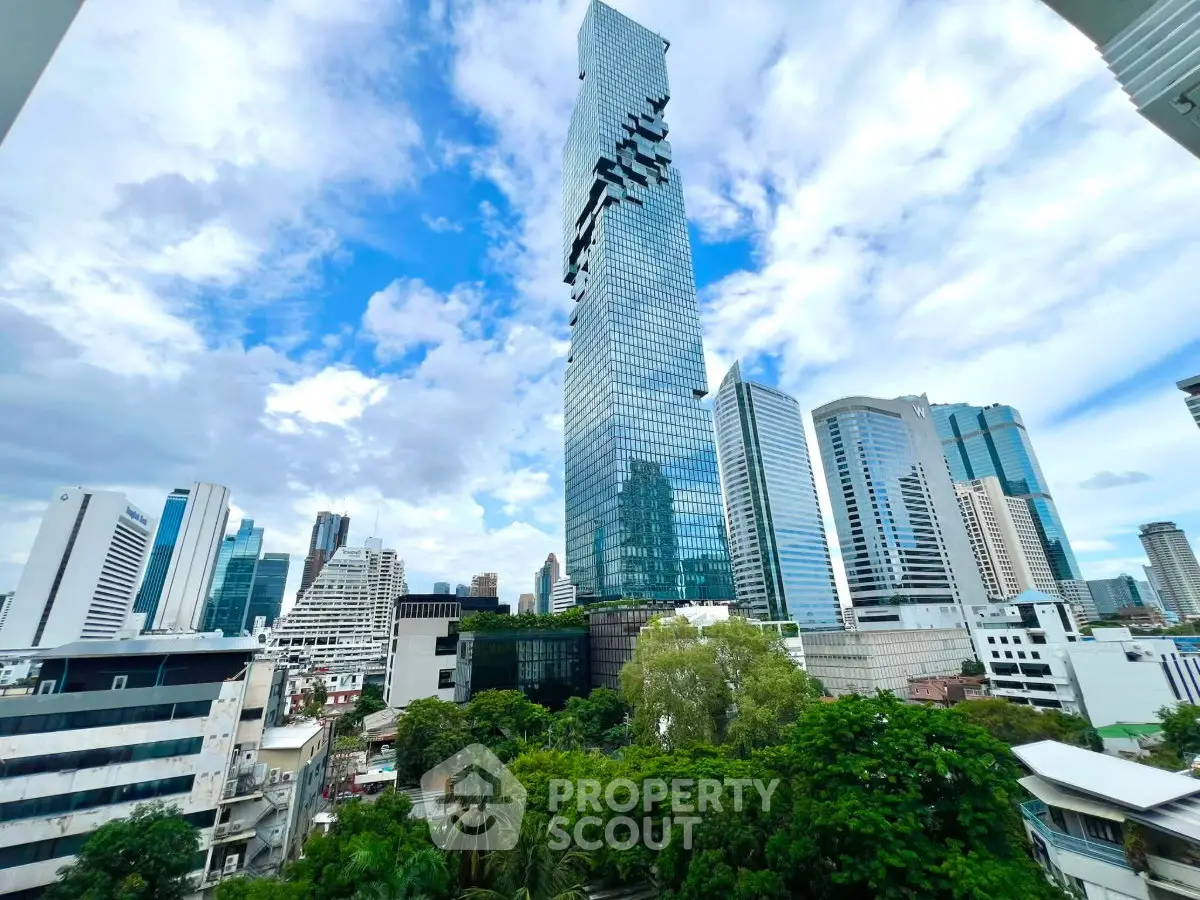 Stunning cityscape view with modern skyscrapers and lush greenery, perfect for urban living enthusiasts.