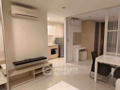 Modern open-plan living area with sleek kitchen and dining space