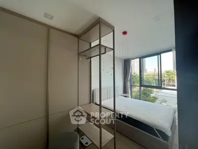 Modern bedroom with large windows and stylish decor in urban apartment