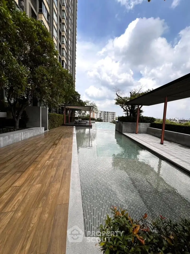 Luxurious rooftop pool with stunning city views and modern design, perfect for relaxation and leisure.