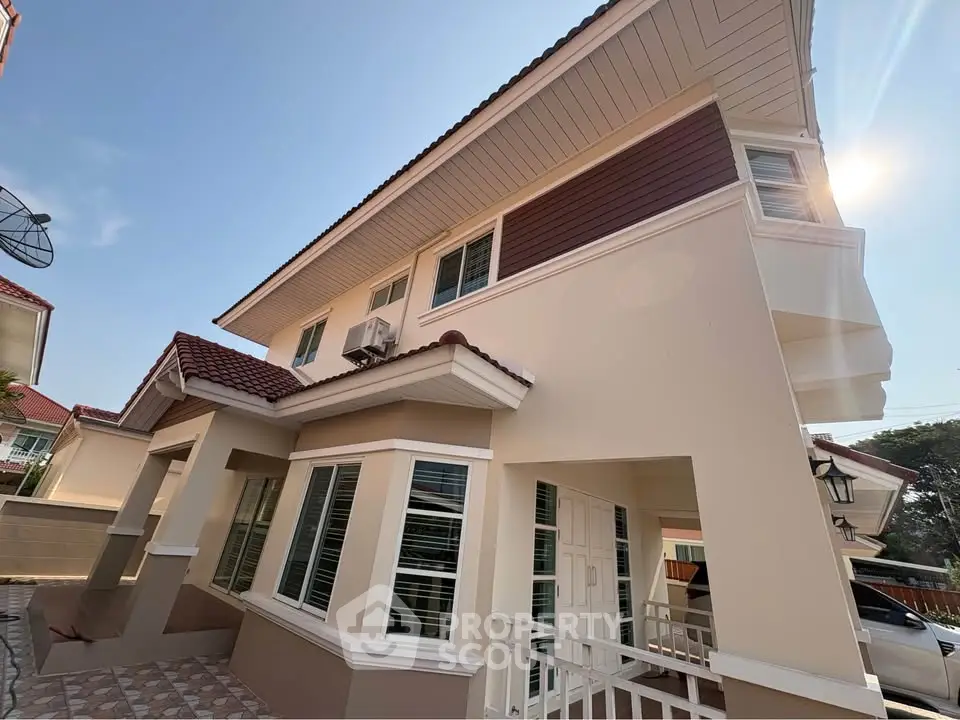 Stunning two-story house with modern architecture and spacious windows, perfect for family living.