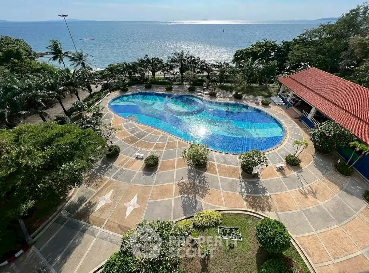 Stunning oceanfront pool with lush greenery and panoramic sea views