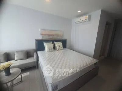Modern bedroom with air conditioning and stylish decor in a contemporary apartment.