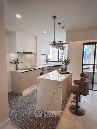 Luxurious modern kitchen with marble island and stylish bar stools, featuring open layout and city view.