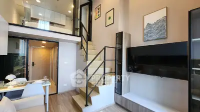 Modern loft apartment with stylish staircase and open living area