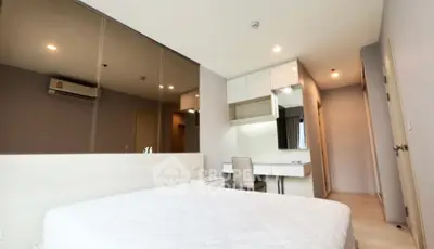 Modern bedroom with sleek design and built-in study area, perfect for urban living.