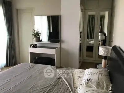 Cozy bedroom with mirrored wardrobe and stylish decor