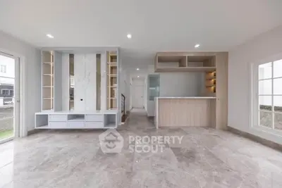 Spacious modern living room with open layout and elegant marble flooring