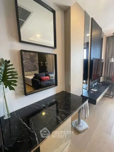 Modern living room with stylish decor and black marble accents