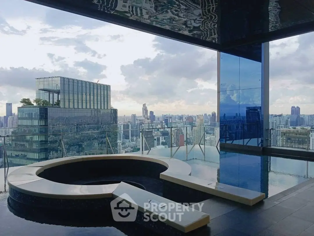 Luxurious rooftop pool with stunning city skyline view, perfect for relaxation and entertainment.