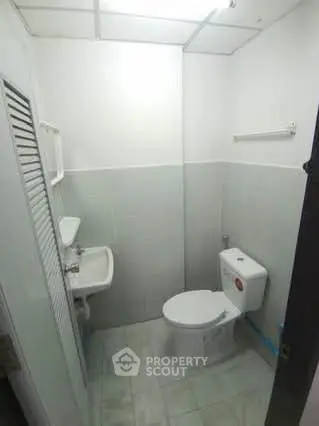 Compact bathroom with modern fixtures and minimalist design