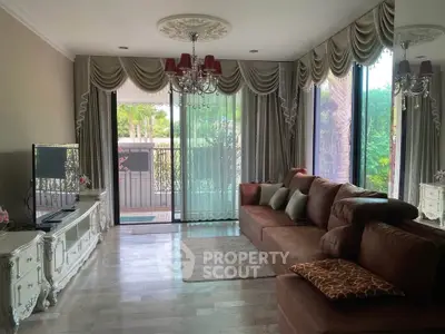 Elegant living room with luxurious curtains and spacious seating area