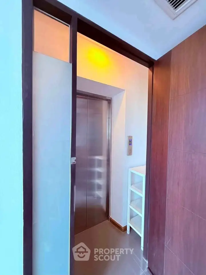Modern residential elevator with sleek design and wooden paneling