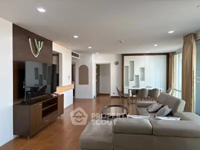 Spacious modern living room with elegant decor and large windows for natural light